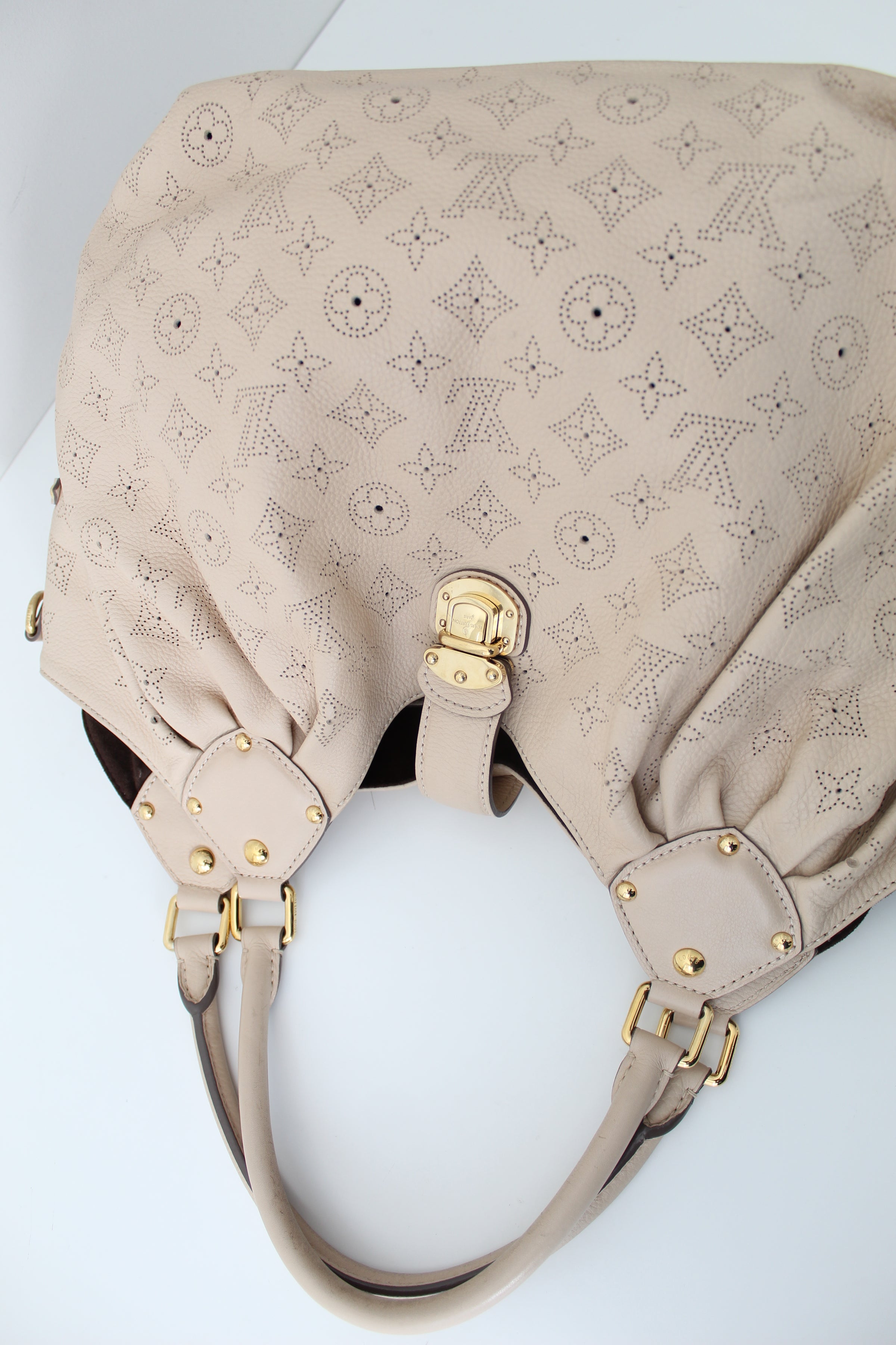 Sold at Auction: LOUIS VUITTON MAHINA HOBO TAUPE BAG